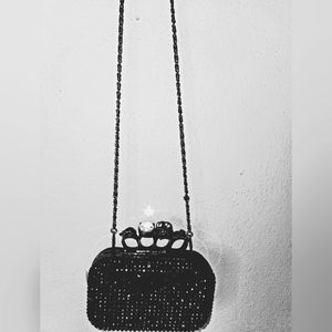 A knock off of Alexander McQueens purse which I have shown in last pic